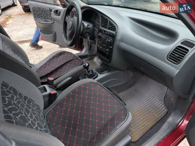 Красный Дэу Ланос, объемом двигателя 1.5 л и пробегом 160 тыс. км за 2750 $, фото 11 на Automoto.ua