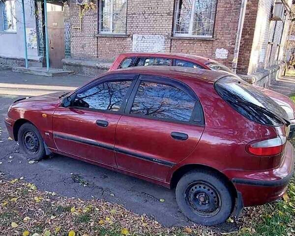 Красный Дэу Ланос, объемом двигателя 1.5 л и пробегом 139 тыс. км за 2400 $, фото 2 на Automoto.ua