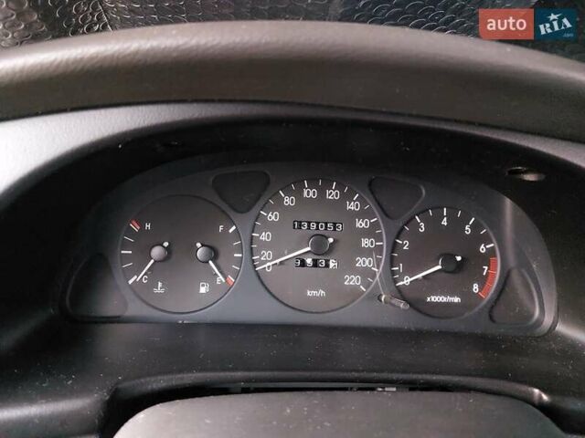 Красный Дэу Ланос, объемом двигателя 1.5 л и пробегом 139 тыс. км за 2400 $, фото 3 на Automoto.ua