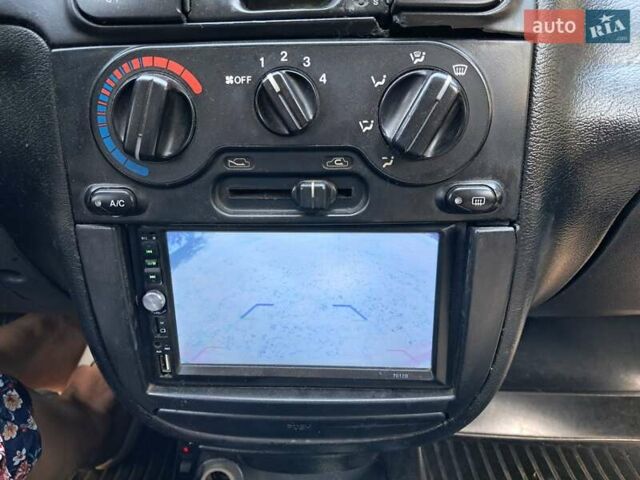 Красный Дэу Ланос, объемом двигателя 1.5 л и пробегом 111 тыс. км за 1900 $, фото 8 на Automoto.ua