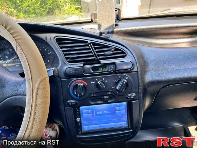 Красный Дэу Ланос, объемом двигателя 1.5 л и пробегом 170 тыс. км за 1600 $, фото 3 на Automoto.ua