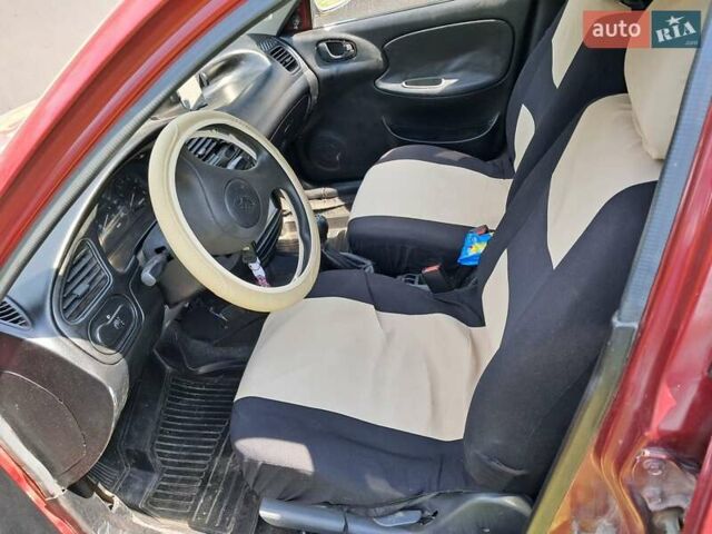 Красный Дэу Ланос, объемом двигателя 1.5 л и пробегом 111 тыс. км за 1900 $, фото 9 на Automoto.ua