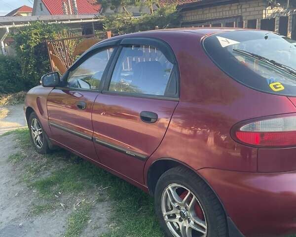 Красный Дэу Ланос, объемом двигателя 1.5 л и пробегом 180 тыс. км за 3100 $, фото 1 на Automoto.ua