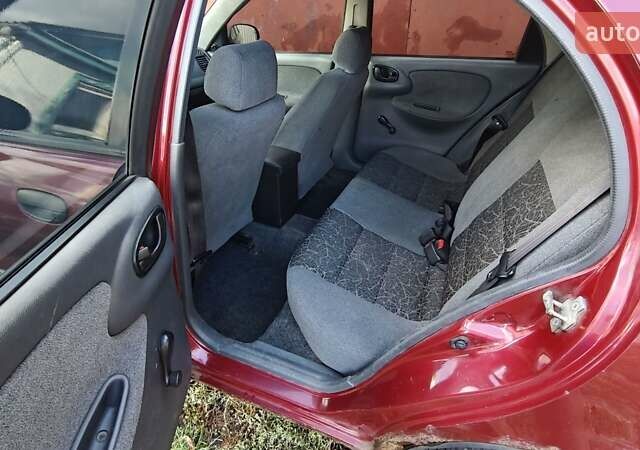 Красный Дэу Ланос, объемом двигателя 1.5 л и пробегом 355 тыс. км за 1850 $, фото 5 на Automoto.ua