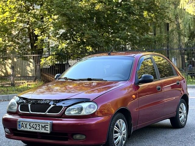 Красный Дэу Ланос, объемом двигателя 1.5 л и пробегом 290 тыс. км за 1950 $, фото 4 на Automoto.ua