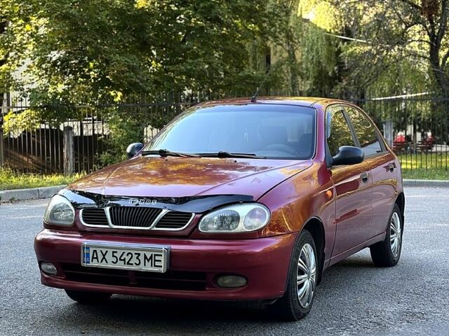 Красный Дэу Ланос, объемом двигателя 1.5 л и пробегом 290 тыс. км за 1950 $, фото 3 на Automoto.ua