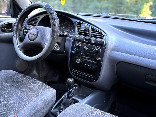 Красный Дэу Ланос, объемом двигателя 1.5 л и пробегом 290 тыс. км за 1950 $, фото 6 на Automoto.ua