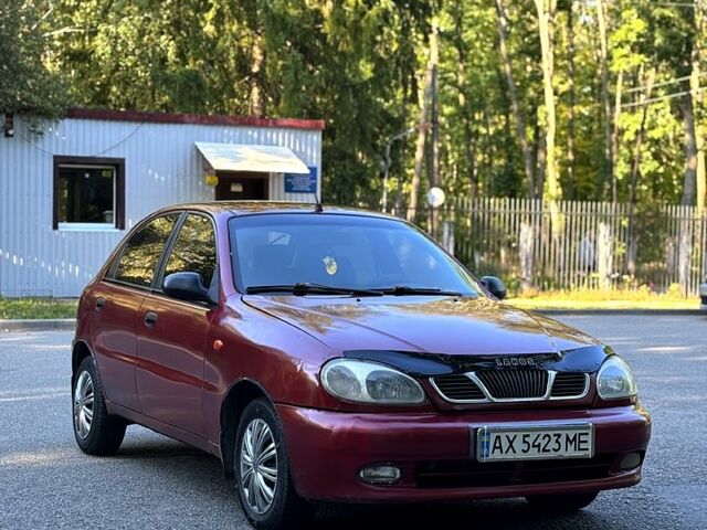 Красный Дэу Ланос, объемом двигателя 1.5 л и пробегом 290 тыс. км за 1950 $, фото 2 на Automoto.ua