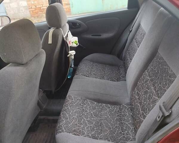 Красный Дэу Ланос, объемом двигателя 1.5 л и пробегом 139 тыс. км за 2999 $, фото 3 на Automoto.ua