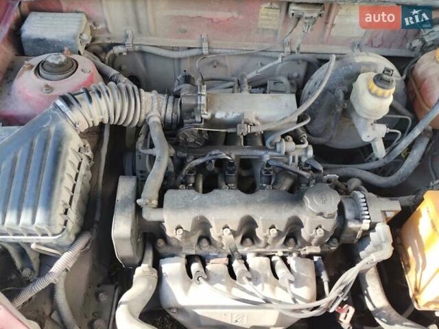 Красный Дэу Ланос, объемом двигателя 1.6 л и пробегом 355 тыс. км за 1600 $, фото 1 на Automoto.ua