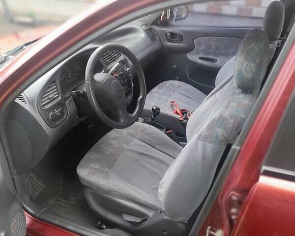 Красный Дэу Ланос, объемом двигателя 1.3 л и пробегом 270 тыс. км за 1600 $, фото 2 на Automoto.ua