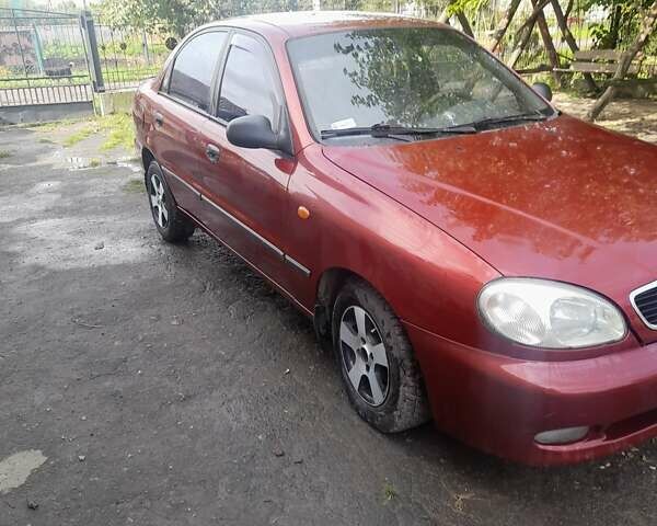 Красный Дэу Ланос, объемом двигателя 1.3 л и пробегом 270 тыс. км за 1600 $, фото 3 на Automoto.ua