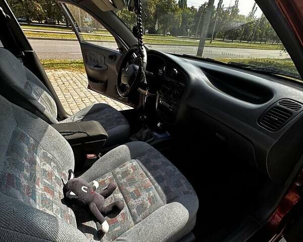 Красный Дэу Ланос, объемом двигателя 1.5 л и пробегом 326 тыс. км за 3100 $, фото 22 на Automoto.ua