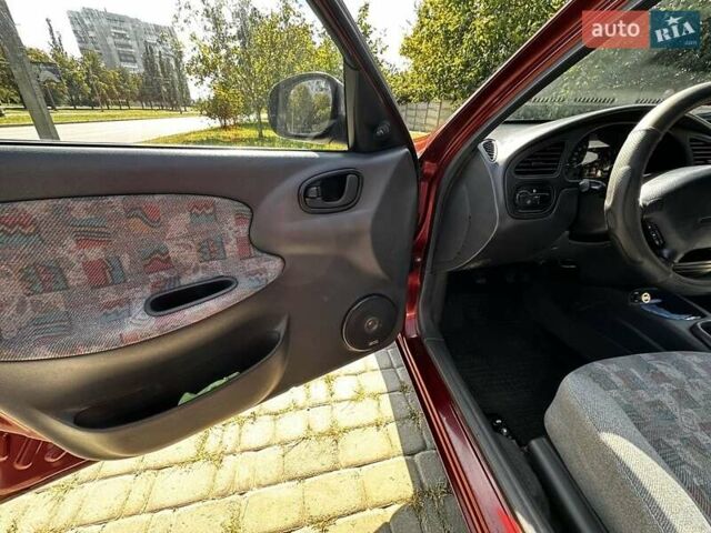 Красный Дэу Ланос, объемом двигателя 1.5 л и пробегом 326 тыс. км за 3100 $, фото 17 на Automoto.ua