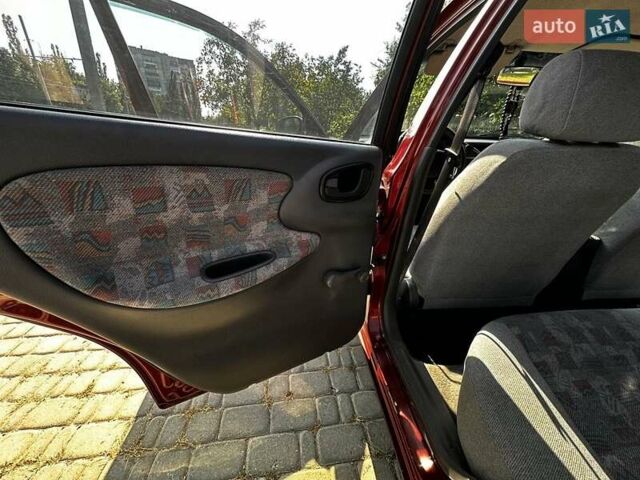 Красный Дэу Ланос, объемом двигателя 1.5 л и пробегом 326 тыс. км за 3100 $, фото 19 на Automoto.ua