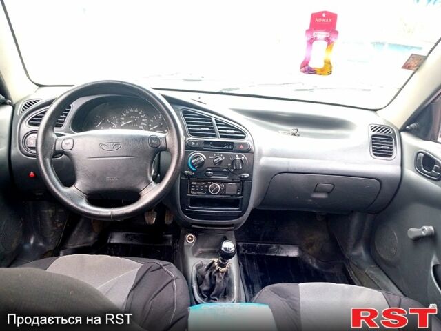 Червоний Деу Ланос, об'ємом двигуна 1.5 л та пробігом 303 тис. км за 1550 $, фото 7 на Automoto.ua