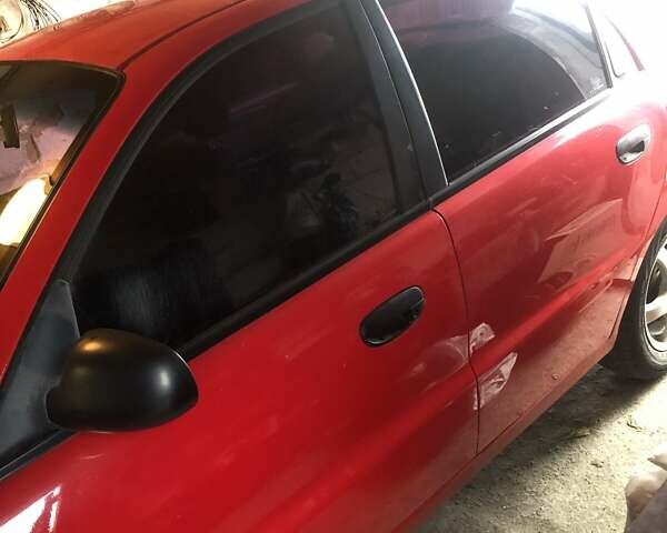 Красный Дэу Ланос, объемом двигателя 1.6 л и пробегом 251 тыс. км за 2300 $, фото 7 на Automoto.ua