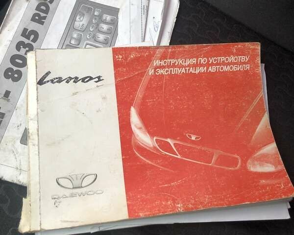 Красный Дэу Ланос, объемом двигателя 1.6 л и пробегом 251 тыс. км за 2300 $, фото 2 на Automoto.ua