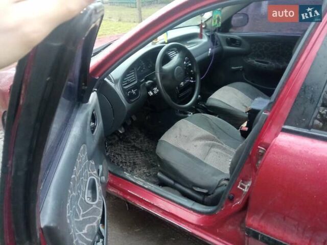 Красный Дэу Ланос, объемом двигателя 1.3 л и пробегом 226 тыс. км за 1500 $, фото 2 на Automoto.ua