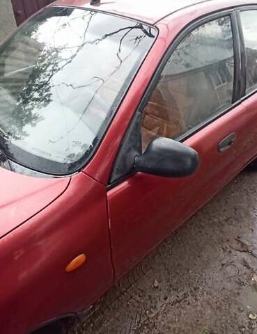 Красный Дэу Ланос, объемом двигателя 1.5 л и пробегом 150 тыс. км за 1000 $, фото 10 на Automoto.ua