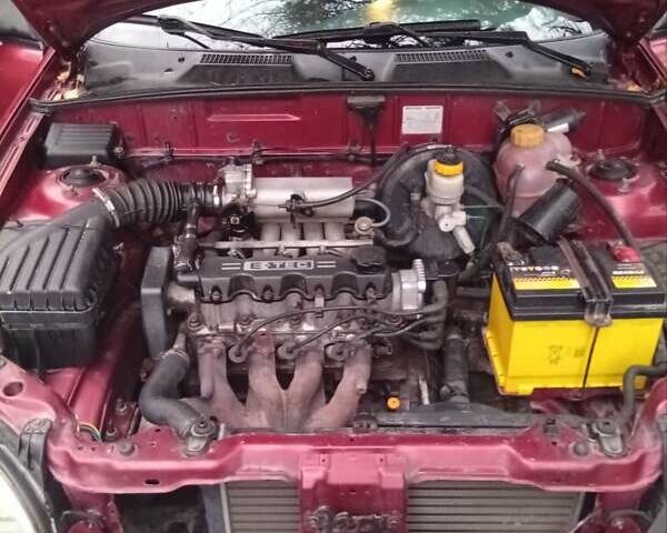 Красный Дэу Ланос, объемом двигателя 1.5 л и пробегом 174 тыс. км за 1750 $, фото 5 на Automoto.ua