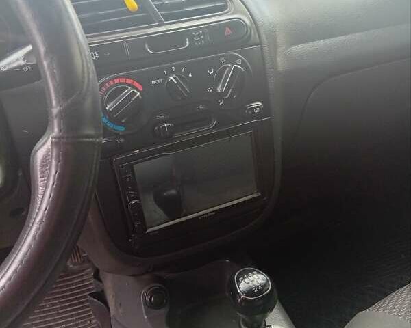 Красный Дэу Ланос, объемом двигателя 1.5 л и пробегом 174 тыс. км за 1550 $, фото 7 на Automoto.ua