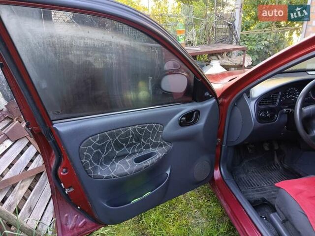 Красный Дэу Ланос, объемом двигателя 1.5 л и пробегом 264 тыс. км за 2800 $, фото 13 на Automoto.ua