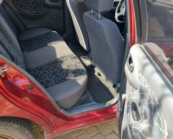 Красный Дэу Ланос, объемом двигателя 1.5 л и пробегом 224 тыс. км за 2000 $, фото 7 на Automoto.ua
