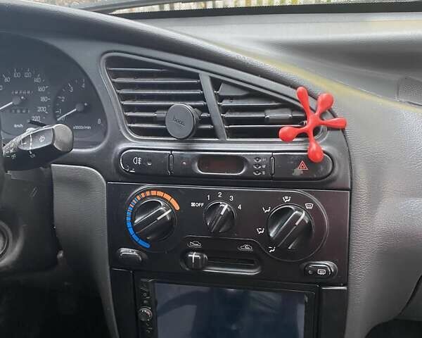 Красный Дэу Ланос, объемом двигателя 1.6 л и пробегом 297 тыс. км за 2500 $, фото 6 на Automoto.ua