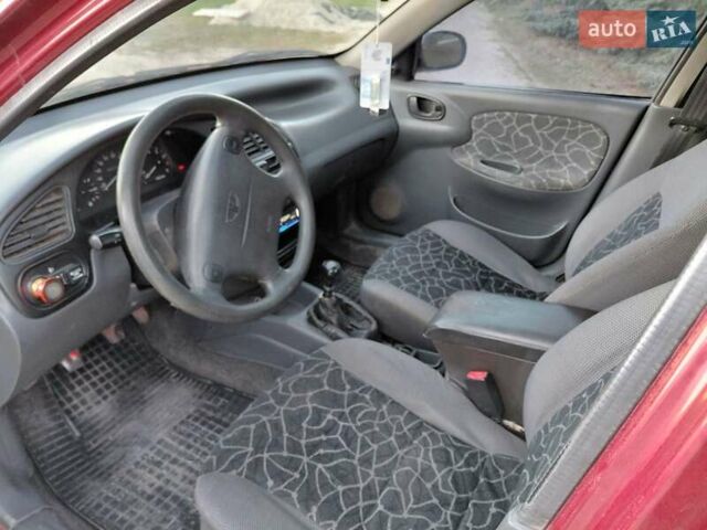 Червоний Деу Ланос, об'ємом двигуна 1.6 л та пробігом 240 тис. км за 2999 $, фото 5 на Automoto.ua