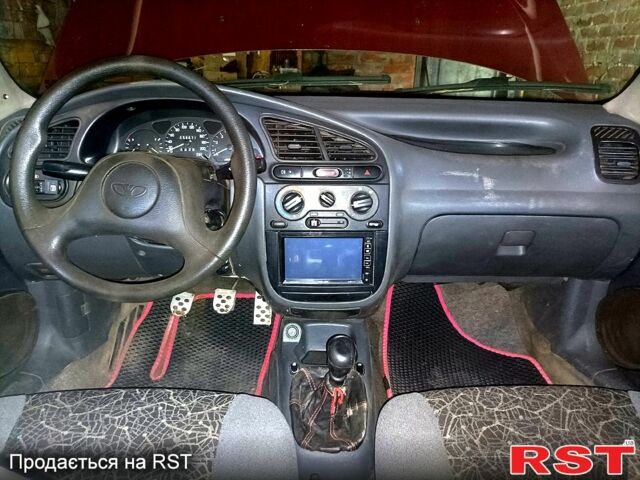 Деу Ланос 2004 у Мерефа на Automoto.ua Червоний Деу Ланос, об'ємом двигуна 1.5 л та пробігом 400 тис. км за 2200 $, фото 6 на Automoto.ua