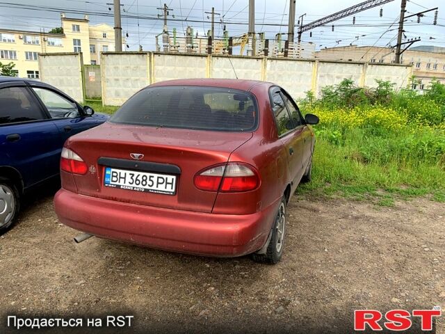 Красный Дэу Ланос, объемом двигателя 1.5 л и пробегом 150 тыс. км за 1900 $, фото 2 на Automoto.ua