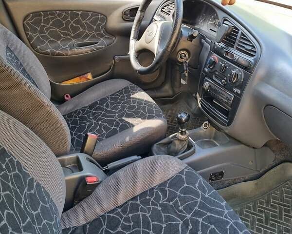 Красный Дэу Ланос, объемом двигателя 1.5 л и пробегом 224 тыс. км за 2000 $, фото 8 на Automoto.ua