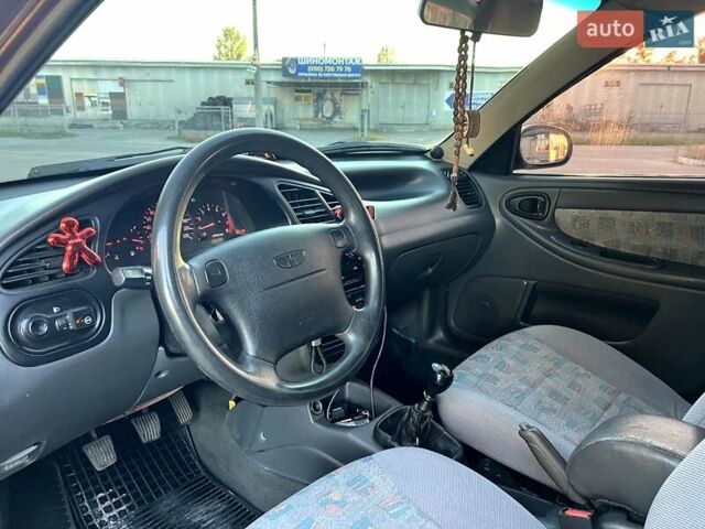 Красный Дэу Ланос, объемом двигателя 1.5 л и пробегом 150 тыс. км за 3300 $, фото 1 на Automoto.ua