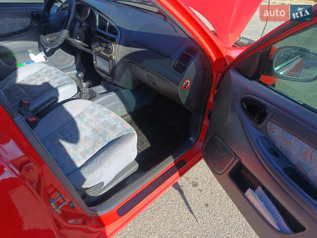 Красный Дэу Ланос, объемом двигателя 1.6 л и пробегом 187 тыс. км за 3150 $, фото 9 на Automoto.ua