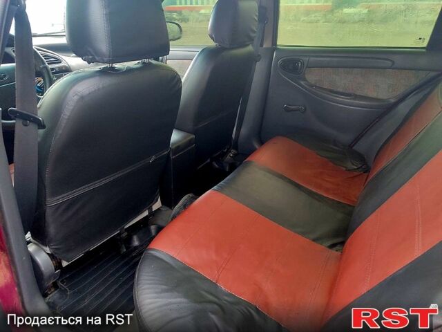 Красный Дэу Ланос, объемом двигателя 1.5 л и пробегом 150 тыс. км за 2700 $, фото 4 на Automoto.ua