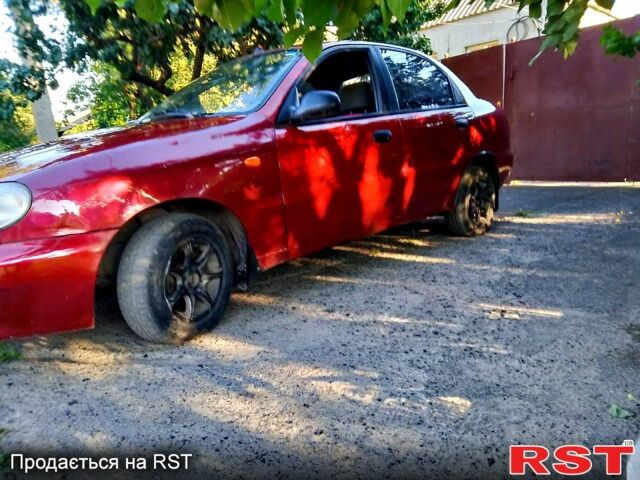 Красный Дэу Ланос, объемом двигателя 1.5 л и пробегом 230 тыс. км за 1700 $, фото 2 на Automoto.ua