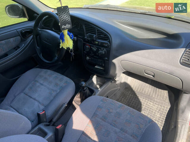 Красный Дэу Ланос, объемом двигателя 1.5 л и пробегом 218 тыс. км за 1800 $, фото 8 на Automoto.ua
