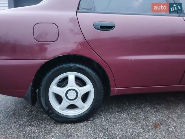Красный Дэу Ланос, объемом двигателя 1.6 л и пробегом 244 тыс. км за 2850 $, фото 3 на Automoto.ua