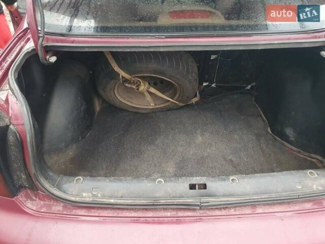 Красный Дэу Ланос, объемом двигателя 1.5 л и пробегом 226 тыс. км за 2400 $, фото 7 на Automoto.ua