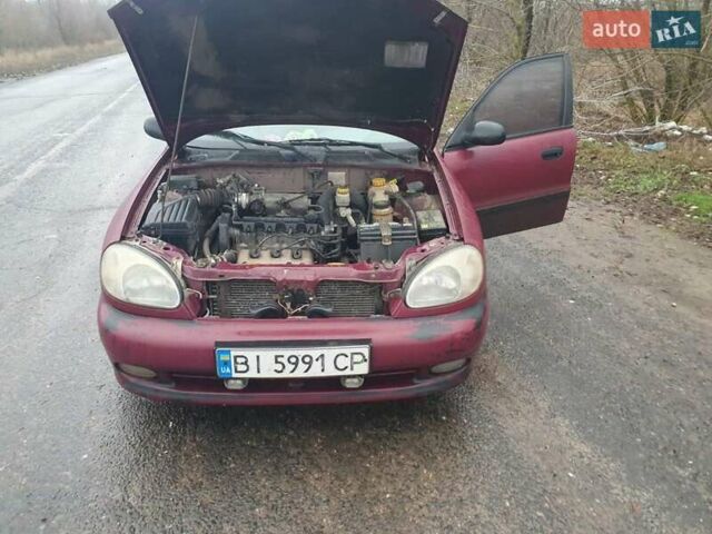 Красный Дэу Ланос, объемом двигателя 1.5 л и пробегом 226 тыс. км за 2400 $, фото 9 на Automoto.ua