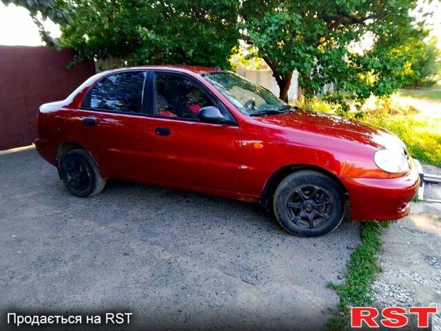 Красный Дэу Ланос, объемом двигателя 1.5 л и пробегом 230 тыс. км за 1700 $, фото 3 на Automoto.ua