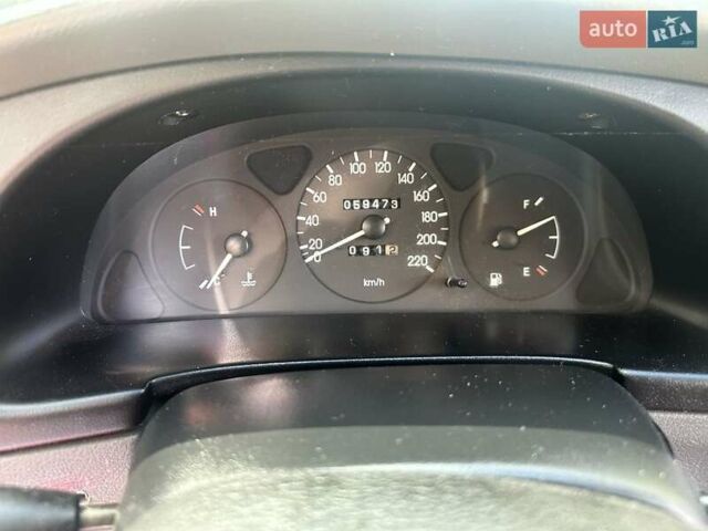 Красный Дэу Ланос, объемом двигателя 1.5 л и пробегом 59 тыс. км за 3750 $, фото 4 на Automoto.ua