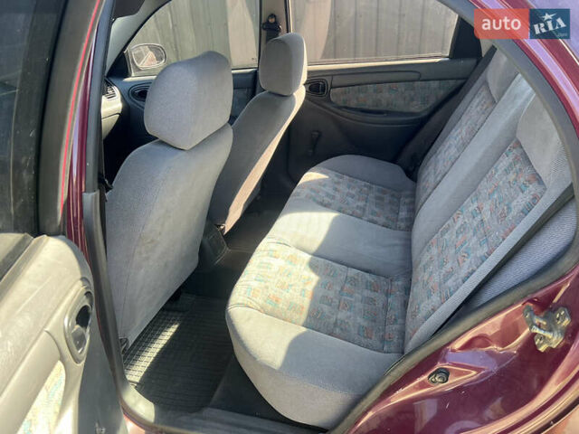 Красный Дэу Ланос, объемом двигателя 1.5 л и пробегом 218 тыс. км за 1800 $, фото 5 на Automoto.ua