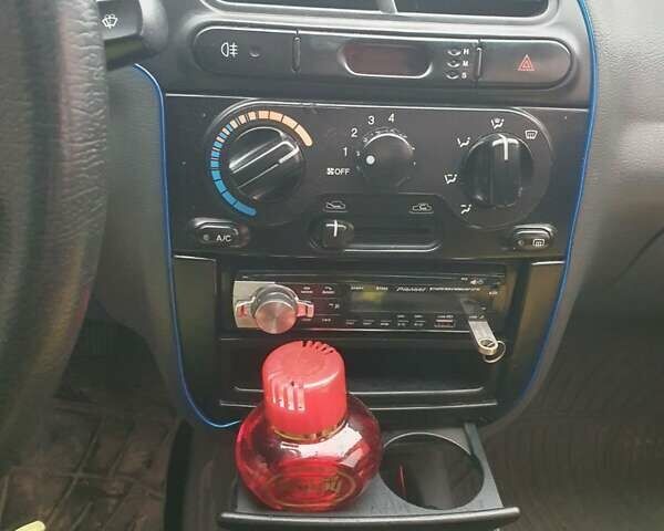 Красный Дэу Ланос, объемом двигателя 1.5 л и пробегом 226 тыс. км за 2400 $, фото 16 на Automoto.ua