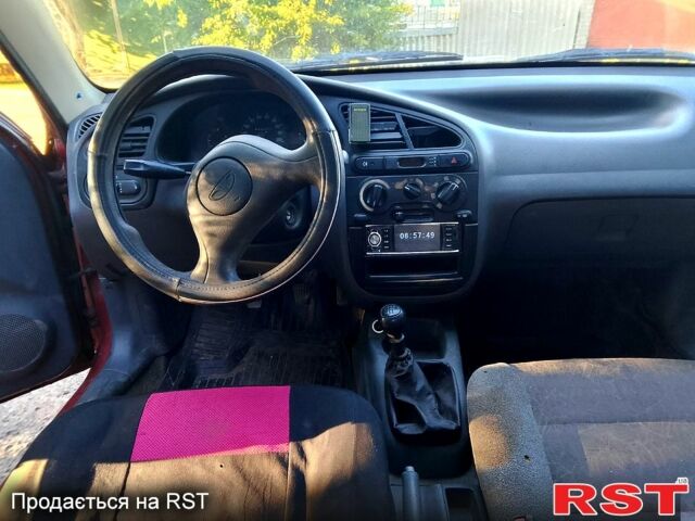 Красный Дэу Ланос, объемом двигателя 1.5 л и пробегом 230 тыс. км за 1700 $, фото 6 на Automoto.ua
