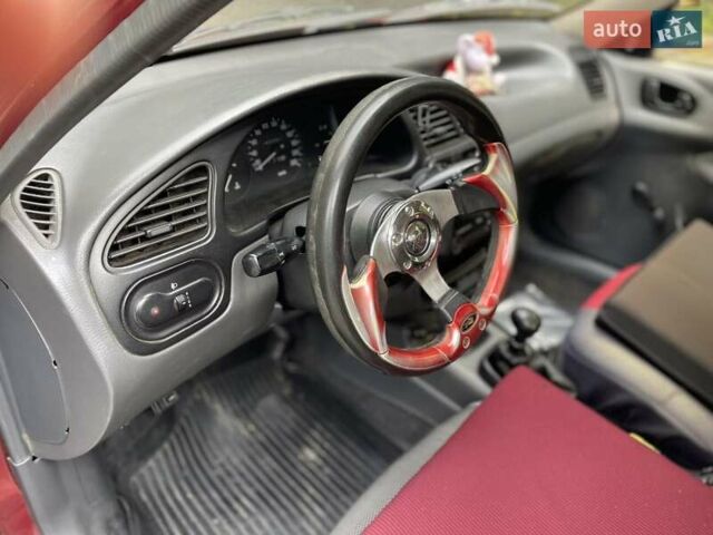 Червоний Деу Ланос, об'ємом двигуна 1.3 л та пробігом 128 тис. км за 1800 $, фото 7 на Automoto.ua