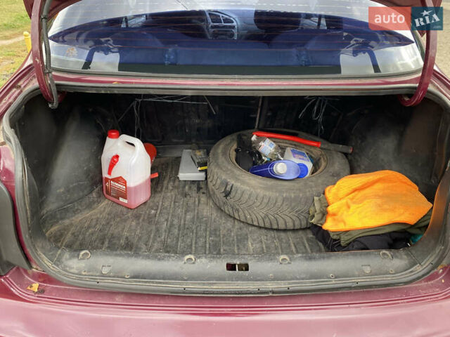 Красный Дэу Ланос, объемом двигателя 1.6 л и пробегом 210 тыс. км за 2000 $, фото 4 на Automoto.ua
