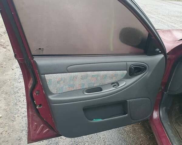 Красный Дэу Ланос, объемом двигателя 1.5 л и пробегом 226 тыс. км за 2400 $, фото 12 на Automoto.ua