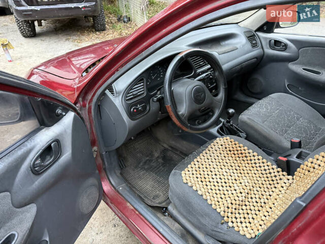 Красный Дэу Ланос, объемом двигателя 1.5 л и пробегом 375 тыс. км за 1400 $, фото 9 на Automoto.ua
